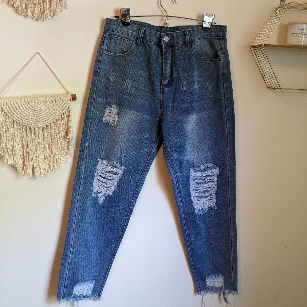 High rise medium wash distressed hem blue jeans